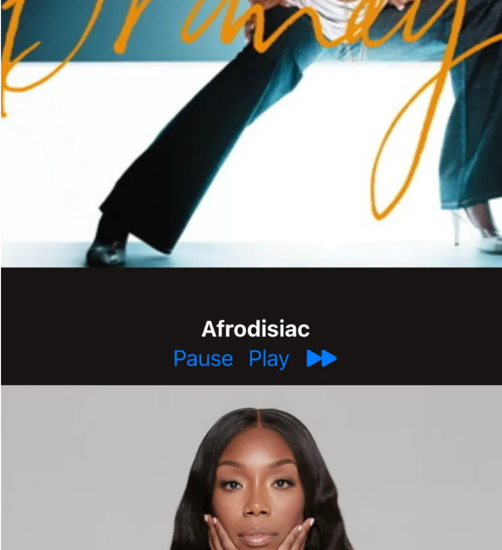 Screenshot of a SwiftUI music player. This capture features artist Brandy's album cover "Afrodisiac" at the top, along with a picture of Brandy herself below. In between is the song title "Afrodisiac", along with blue "pause", "play", and "skip" buttons below it.